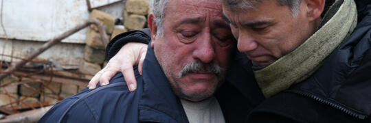 Men from Artsakh crying