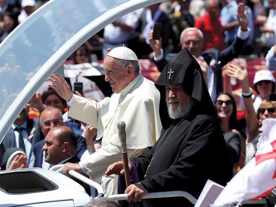 Pope Francis and Catholicos of All Armenians Karekin II leave at the end of a mass at Vardanants Square in Gyumri.