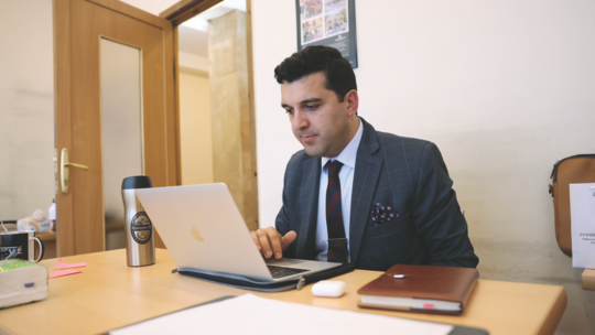 AGBU Scholar Erik Khzmalyan in an office